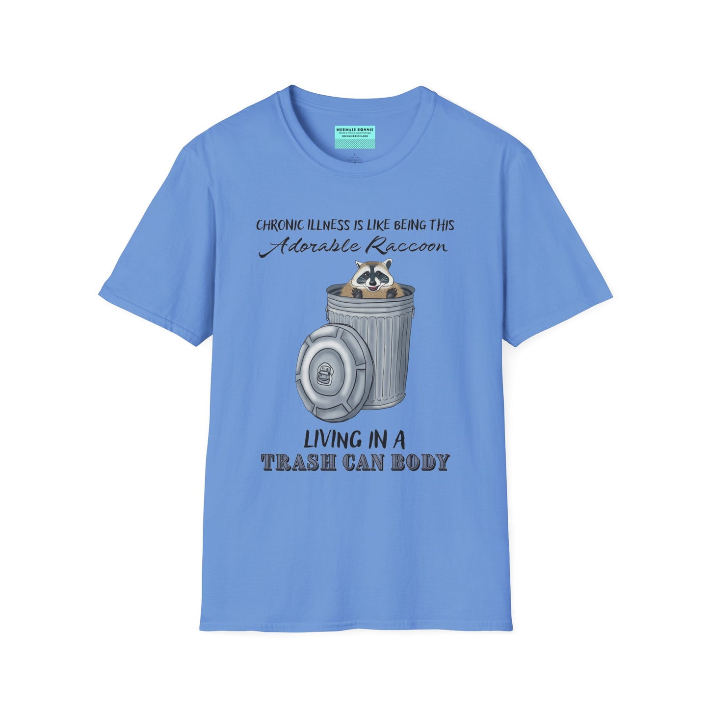 Blue t-shirt featuring an illustration of a raccoon in a metal trash can, with the phrase 'Chronic illness is like being this adorable raccoon living in a trash can body' printed on it.