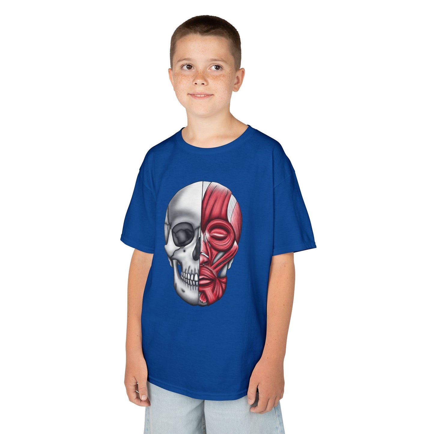 A boy wearing a royal blue kids' t-shirt featuring an anatomical drawing of a human skull, with facial muscles illustrated on one half of the skull.