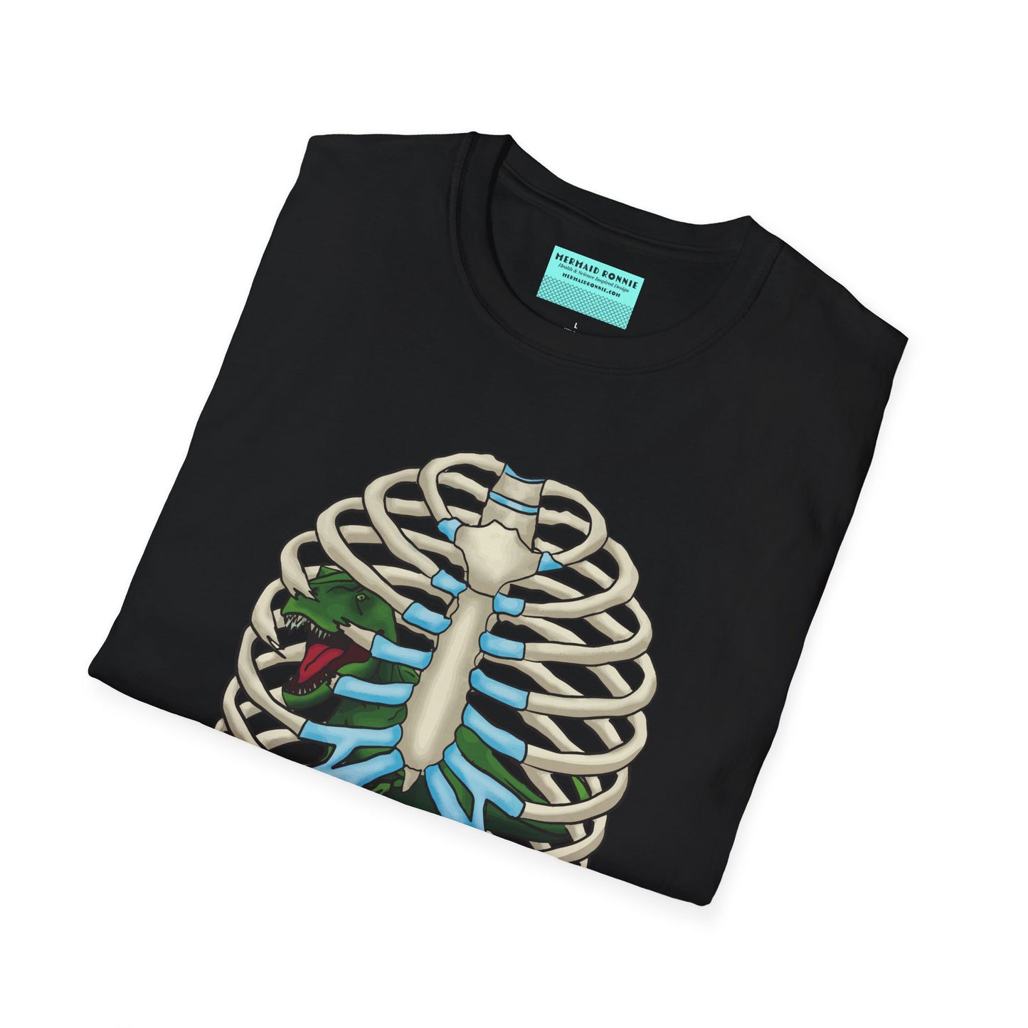 Folded black unisex short sleeve tee with a clever Jurassic twist—an anatomical rib cage doubles as a prehistoric prison for a tiny T-Rex, with the punny caption "Thoracic Park" below. It's dino-mite meets anatomy class in the best way possible.