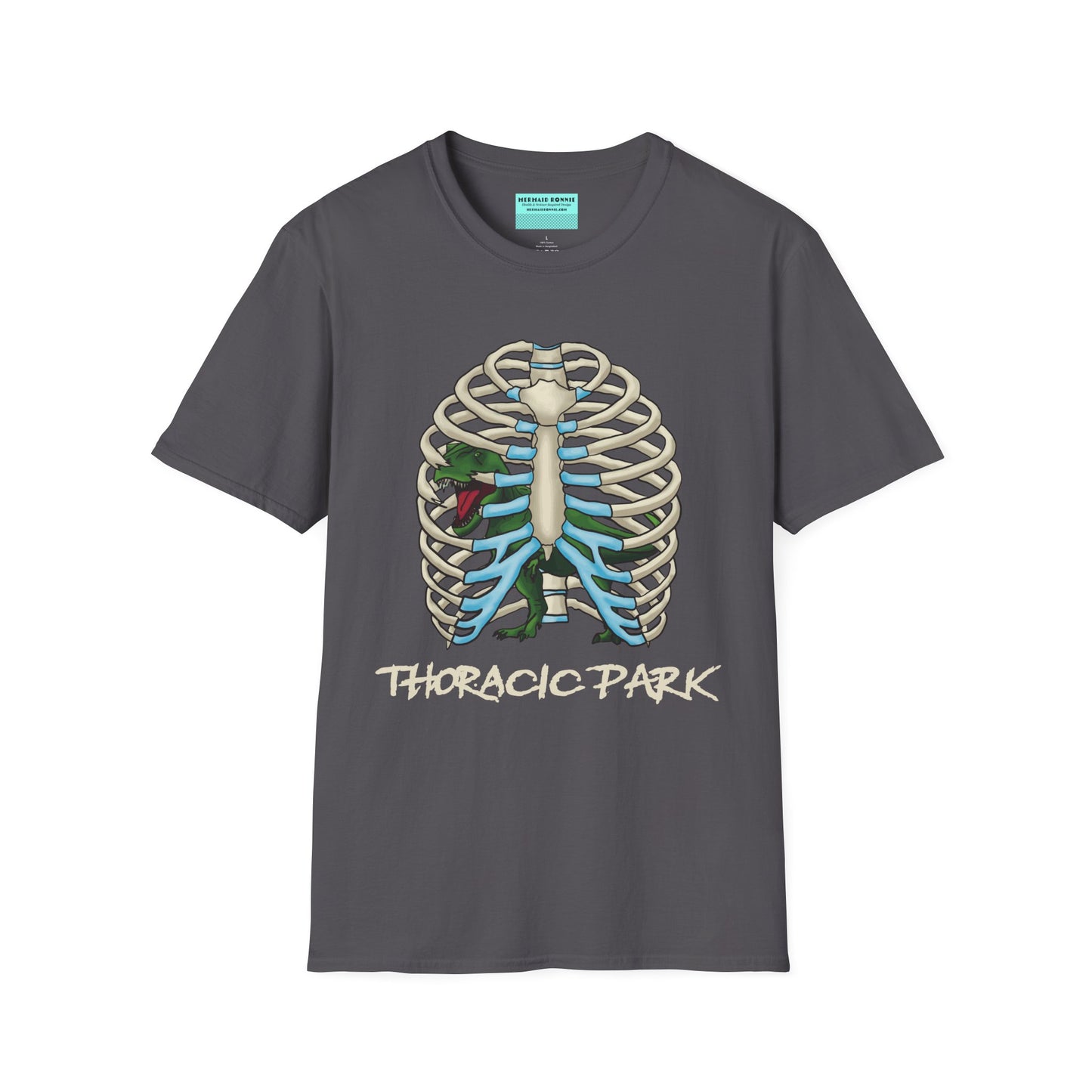 Charcoal grey unisex short sleeve tee with a clever Jurassic twist—an anatomical rib cage doubles as a prehistoric prison for a tiny T-Rex, with the punny caption "Thoracic Park" below. It's dino-mite meets anatomy class in the best way possible.
