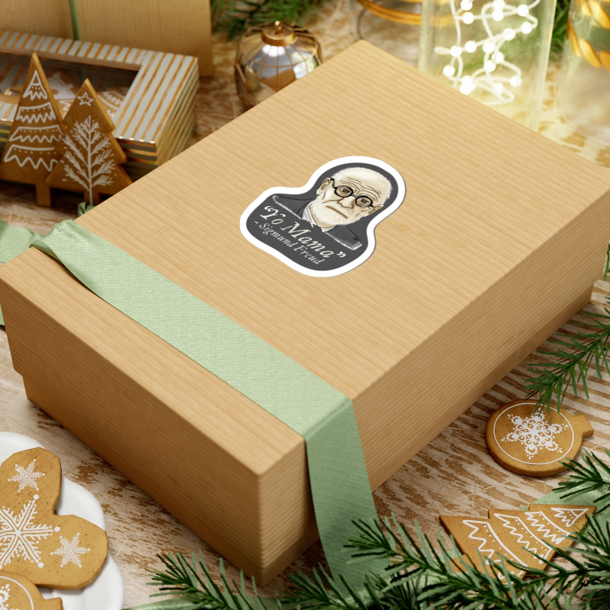 Small sticker adhered to a gift featuring a portrait of Sigmund Freud with the humorous quote 'yo mama' written below him.