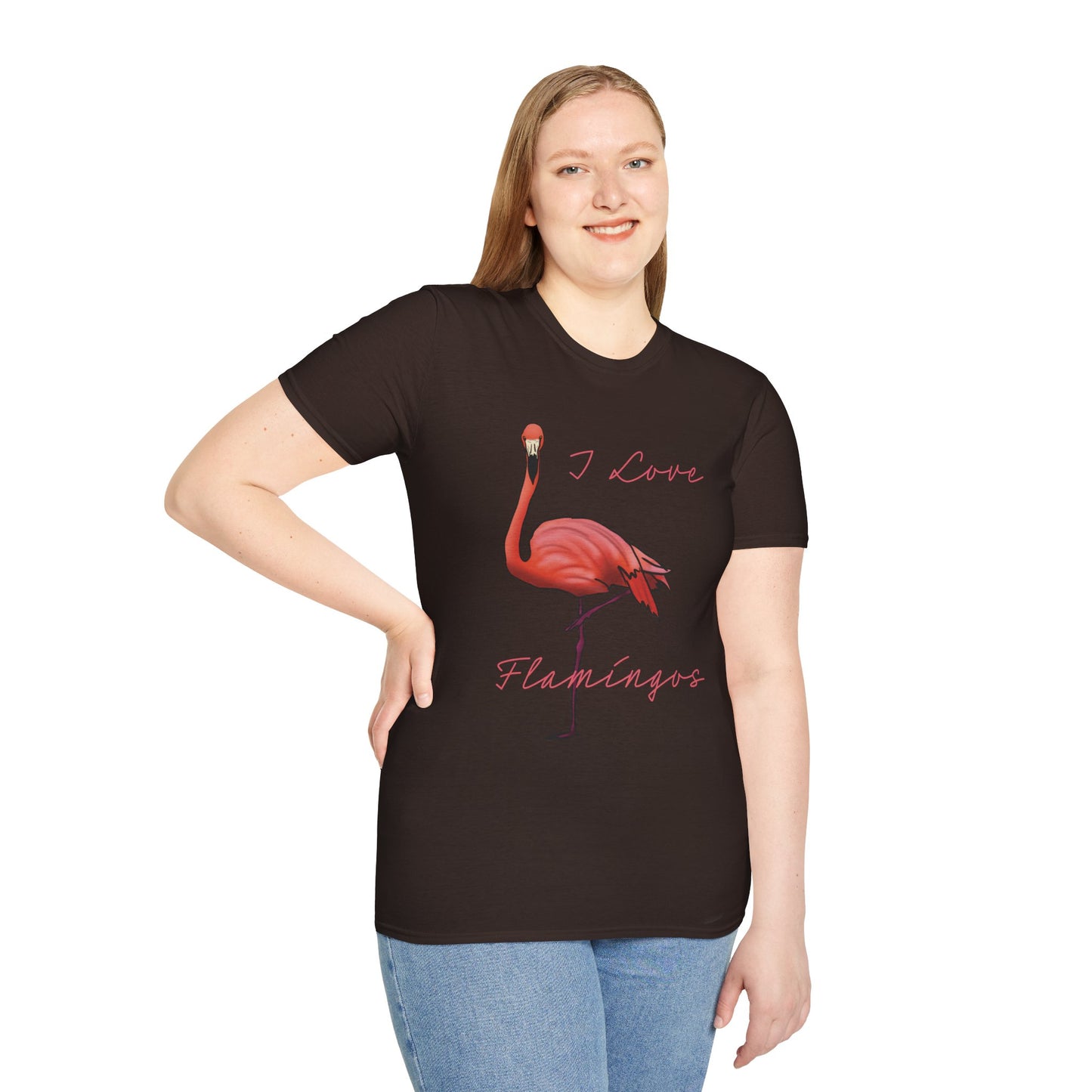 Woman wearing a brown unisex short-sleeve tee with a fabulously pink flamingo strutting its stuff and the words “I love flamingos” — for anyone whose spirit animal stands on one leg.
