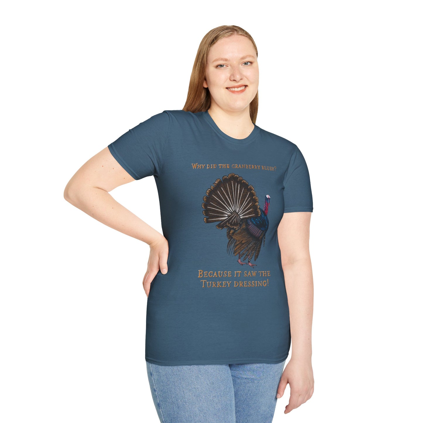 Woman wearing a blue Thanksgiving t-shirt featuring a picture of a turkey and the text 'Why did the cranberry blush? Because it saw the turkey dressing!
