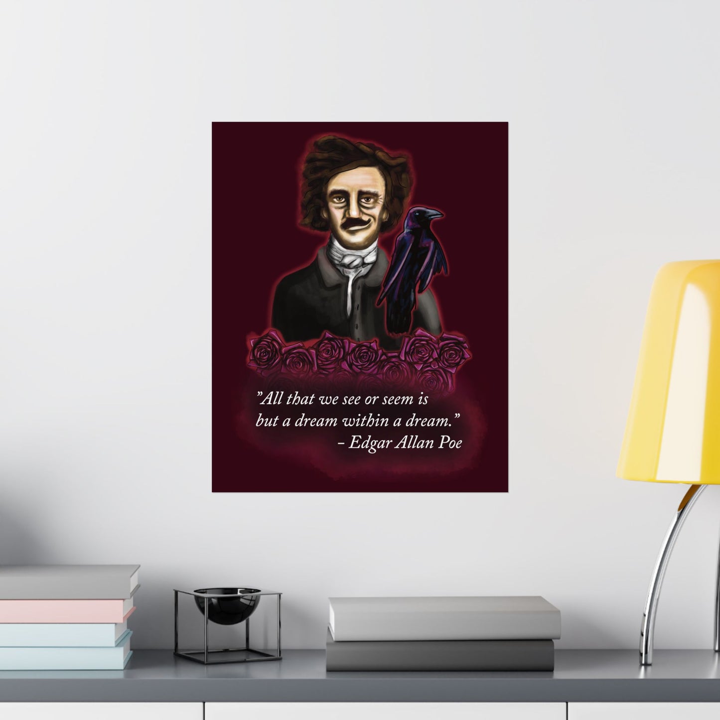 A large moody poster of Edgar Allan Poe hung in an office setting. He is wearing a wry smile as he’s surrounded by crimson roses and a raven, with a rich burgundy background—because even the master of macabre has a soft spot for gothic romance.