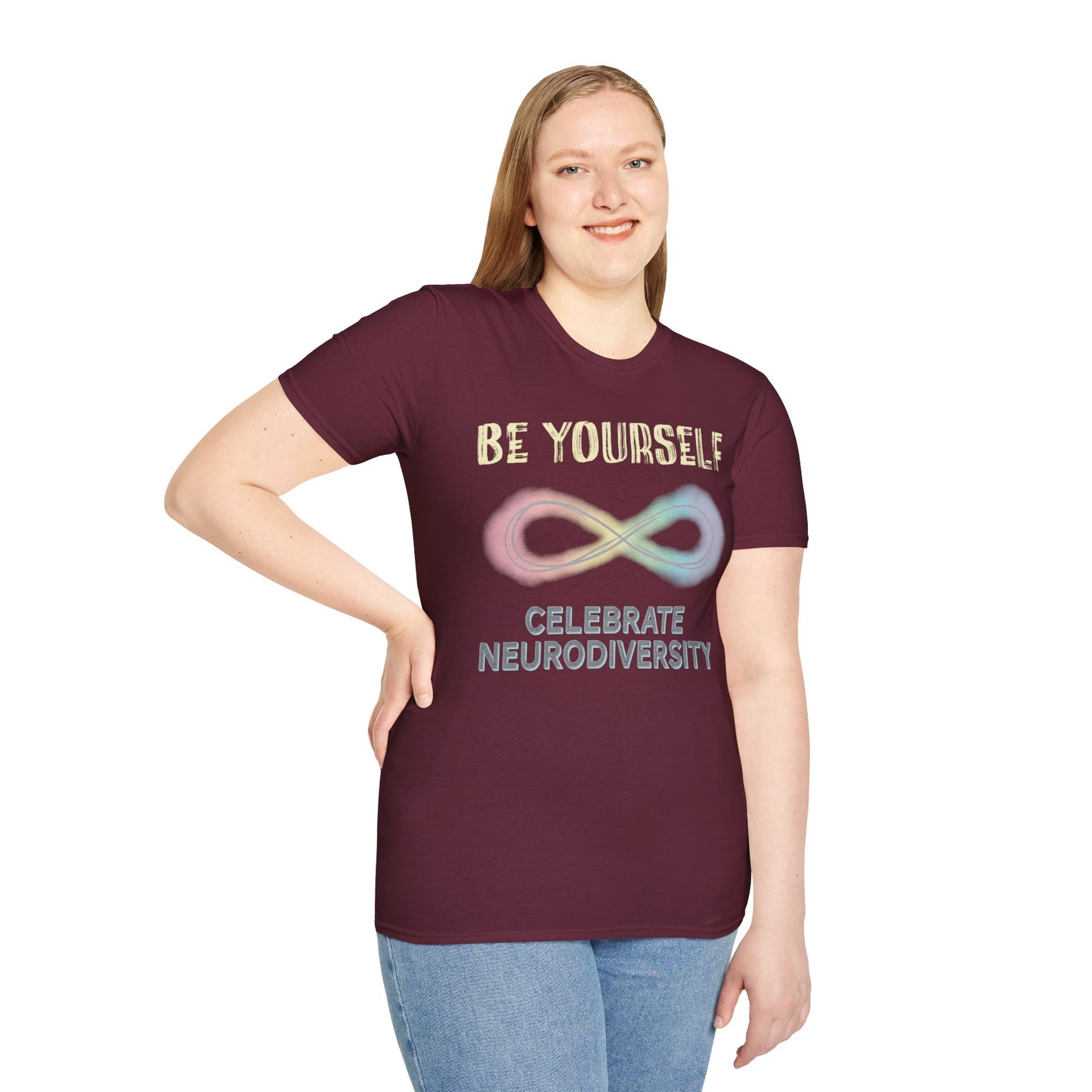 Woman wearing a burgundy t-shirt featuring a pastel-colored rainbow infinity symbol, with the text 'Be yourself, celebrate neurodiversity'.