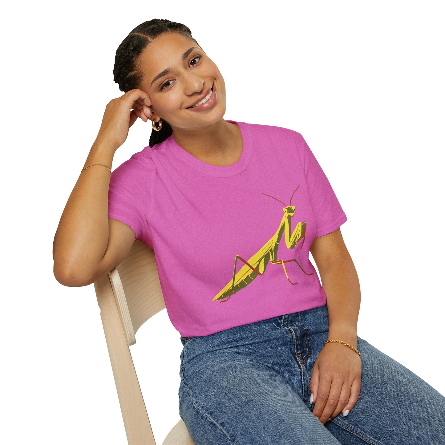 Woman wearing a pink shirt featuring an illustration of a green praying mantis on the front.