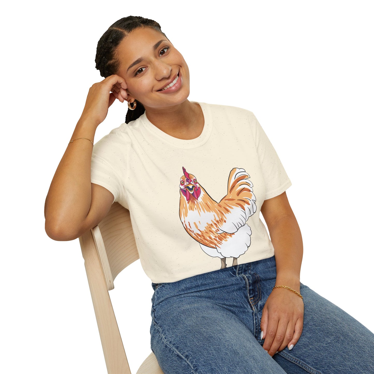 Woman wearing a beige t-shirt featuring an illustration of a chicken.