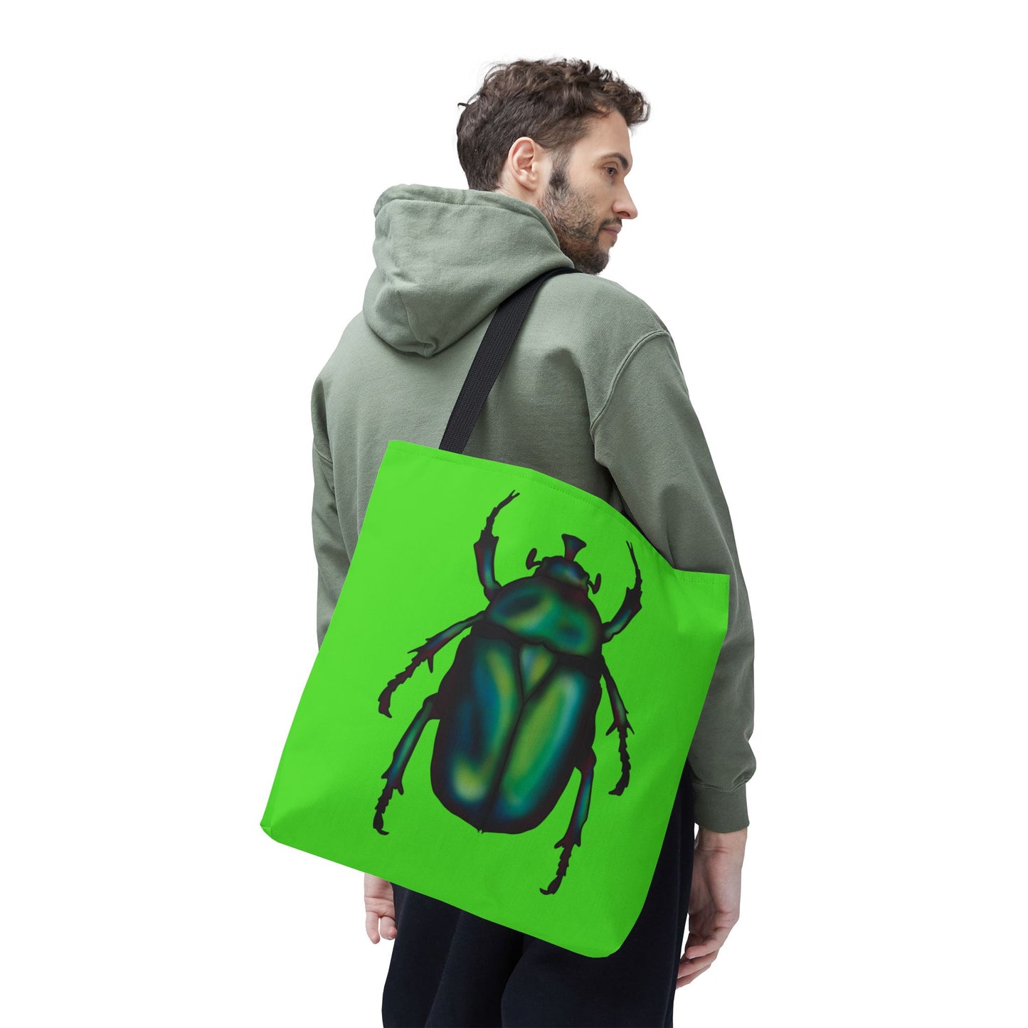 Large lime green tote bag with a black handle on a man's shoulder featuring an illustration of a June bug (green chafer beetle).