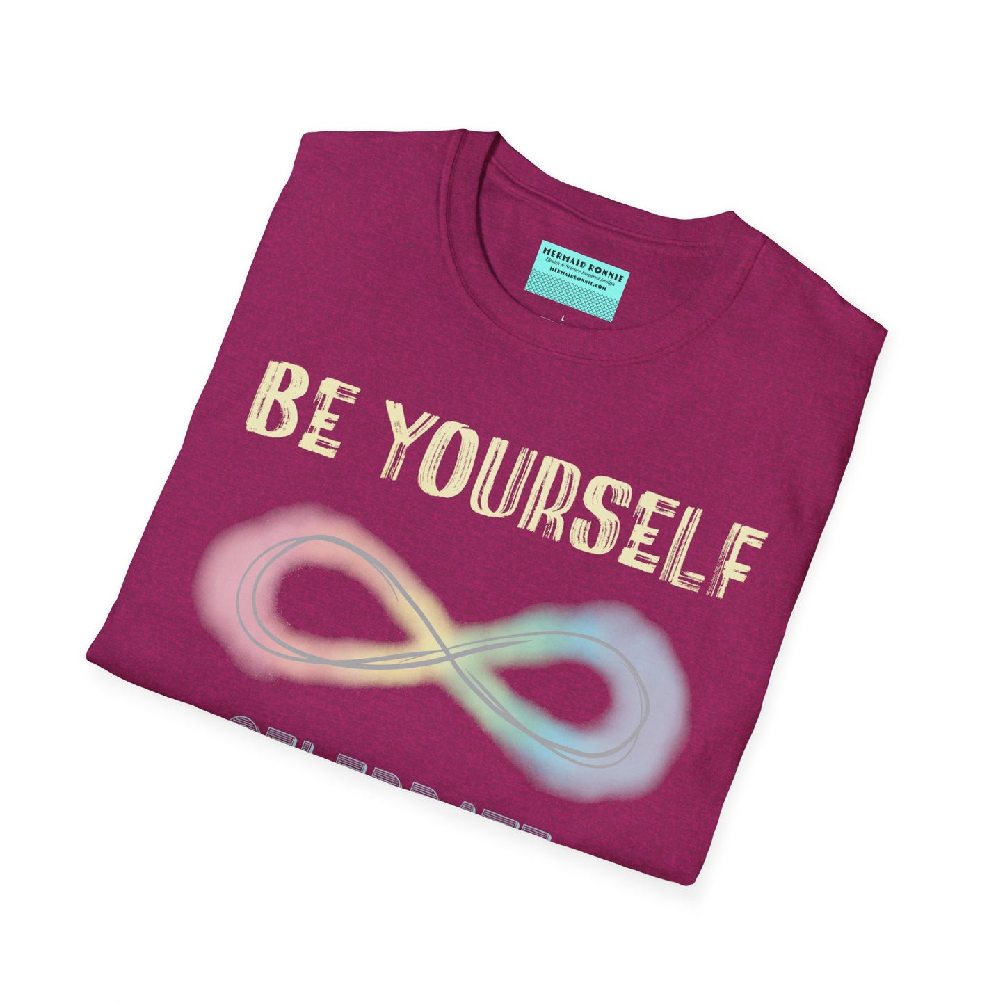 Folded fuscia t-shirt featuring a pastel-colored rainbow infinity symbol, with the text 'Be yourself, celebrate neurodiversity'.