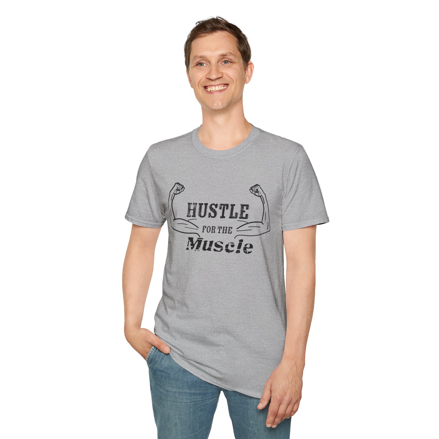 Man wearing a grey unisex short sleeve t-shirt with a bold graphic of strong, flexed feminine arms and the empowering phrase "Hustle for the Muscle"—because strength is stylish and lifting is for everyone.