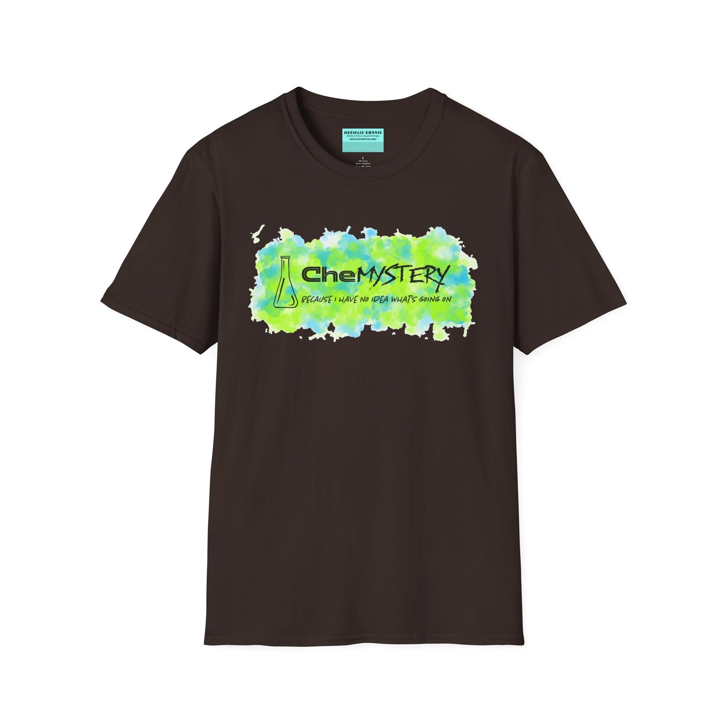 Brown short-sleeve unisex t-shirt with playful watercolor-style blue and green splotches, a simple line-drawn beaker, and the witty phrase “CheMystery: because I have no idea what’s going on”—perfect for anyone who’s ever been personally victimized by the periodic table.