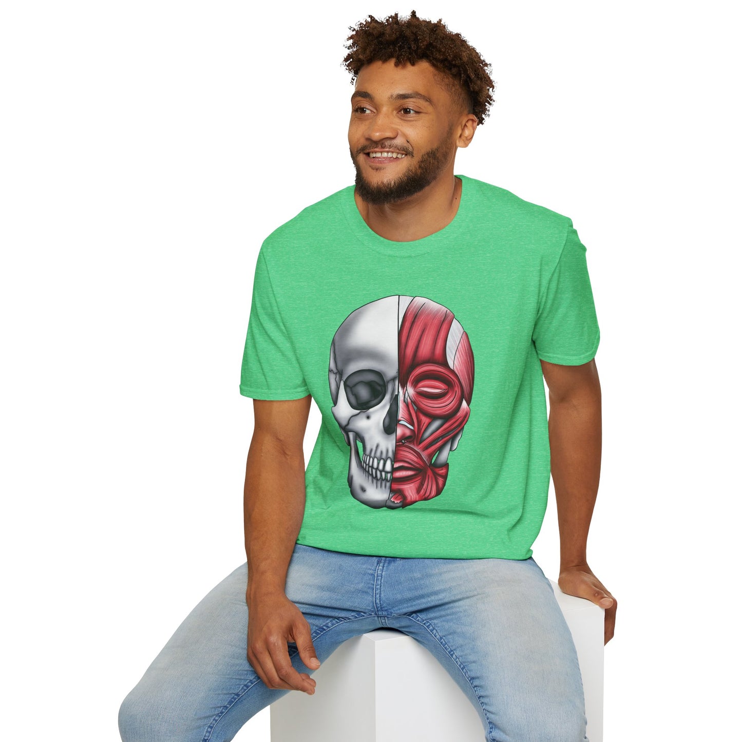 Man wearing a green shirt featuring an anatomically correct skull illustration, with half of the skull covered by facial muscles.