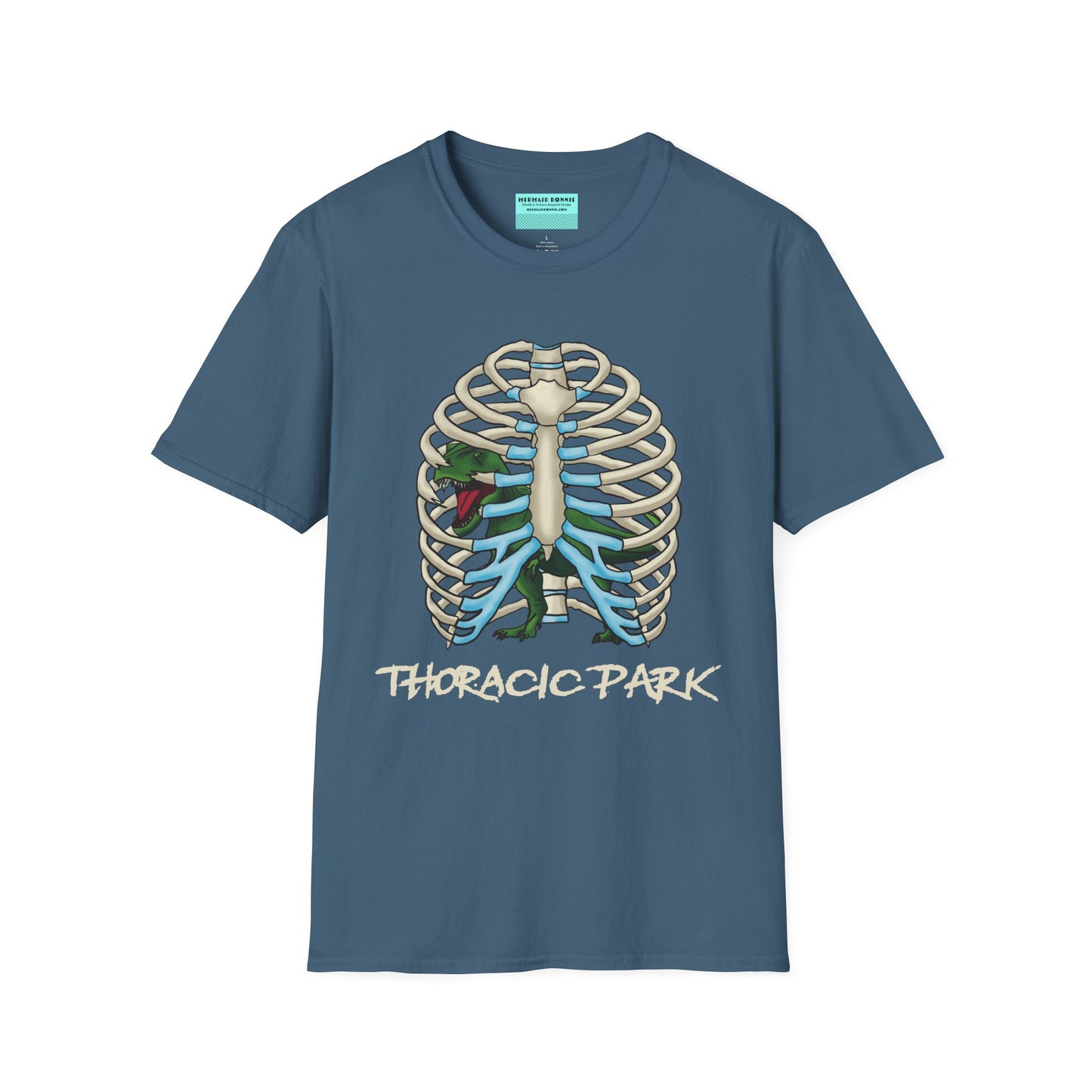 Indigo blue unisex short sleeve tee with a clever Jurassic twist—an anatomical rib cage doubles as a prehistoric prison for a tiny T-Rex, with the punny caption "Thoracic Park" below. It's dino-mite meets anatomy class in the best way possible.