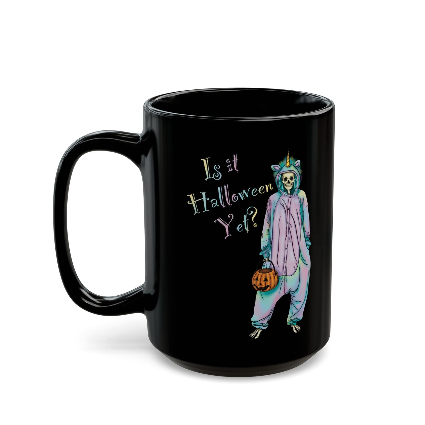 Left view of a large black coffee mug featuring a whimsical illustration of a skeleton dressed in a pastel unicorn onesie, complete with a horn and rainbow accents; the playful text reads "Is it Halloween yet?"—because spooky season should be year-round.