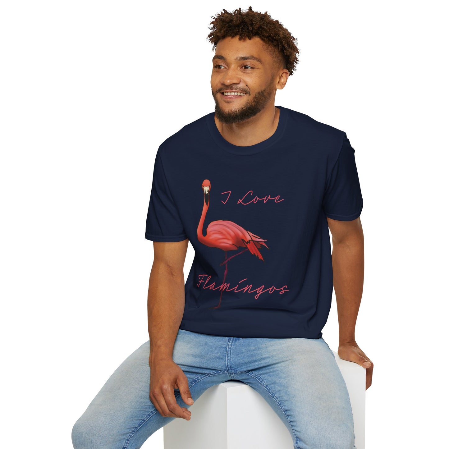 Man wearing a navy unisex short-sleeve tee with a fabulously pink flamingo strutting its stuff and the words “I love flamingos” — for anyone whose spirit animal stands on one leg.