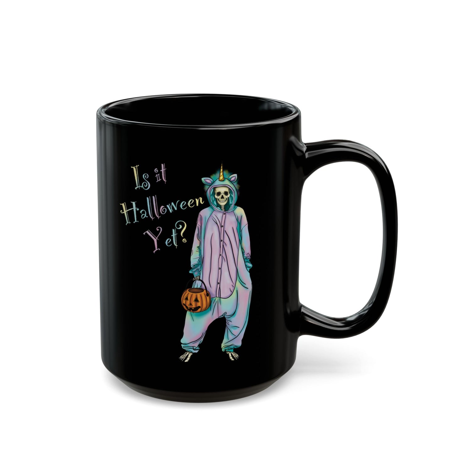 Black coffee mug featuring a whimsical illustration of a skeleton dressed in a pastel unicorn onesie, complete with a horn and rainbow accents; the playful text reads "Is it Halloween yet?"—because spooky season should be year-round.