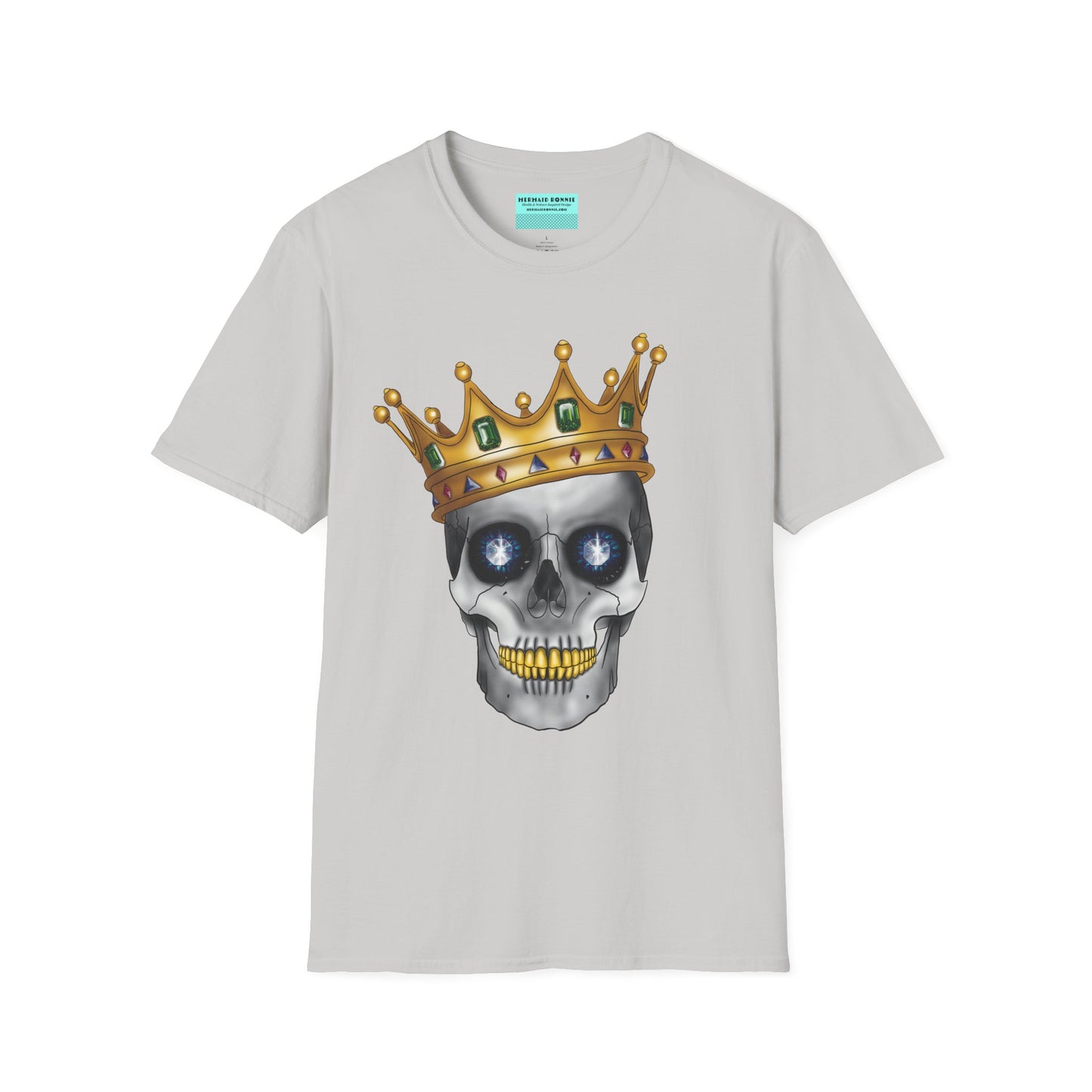Light grey t-shirt featuring an anatomical skull wearing an ornate crown, with gold teeth, large sapphire gemstones in the eye sockets, and emeralds and rubies decorating the crown.