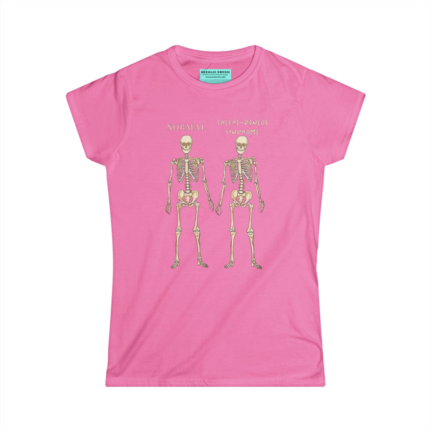 Women’s t-shirt in pink with two skeletons side by side. The first is labeled 'Normal' and the second is labeled 'Ehlers-Danlos Syndrome,' visually illustrating the skeletal effects of EDS.