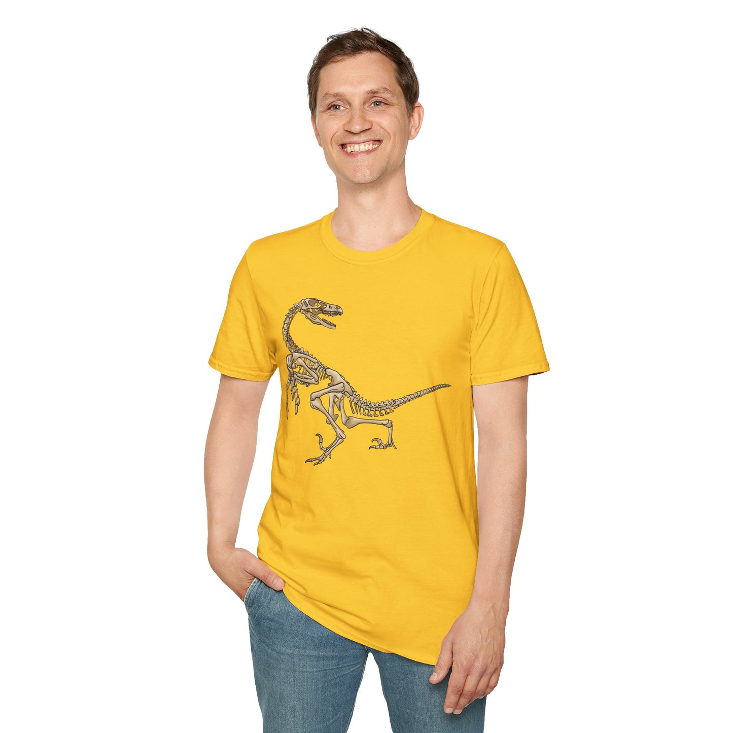 Man wearing a yellow unisex short sleeve t-shirt with a fierce velociraptor skeleton strutting across the chest—because who says extinct can’t be stylish?