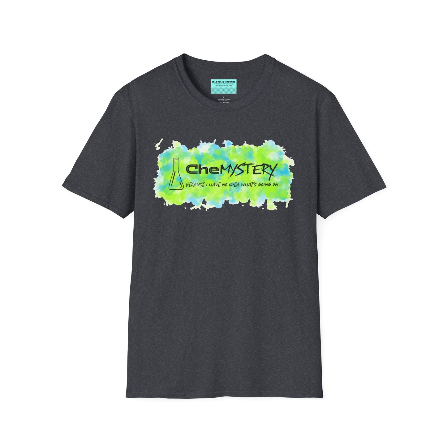 Dark grey short-sleeve unisex t-shirt with playful watercolor-style blue and green splotches, a simple line-drawn beaker, and the witty phrase “CheMystery: because I have no idea what’s going on”—perfect for anyone who’s ever been personally victimized by the periodic table.