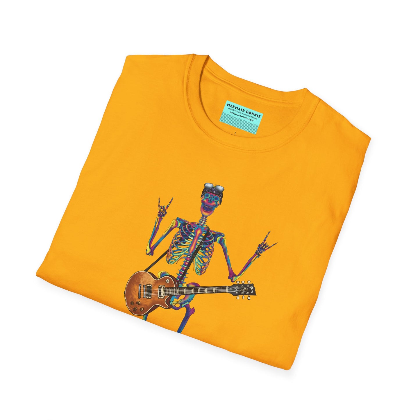 Folded yellow t-shirt featuring a tie-dye skeleton holding a guitar, dressed like a classic rocker with boots, a bandana, and rock-style clothing.