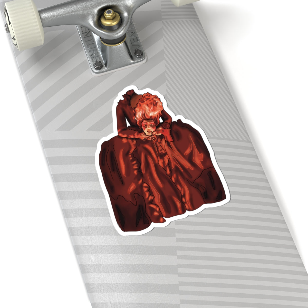 Medium sticker on a skateboard featuring a drawing of Marie Antoinette dressed in red, holding her own head after beheading.