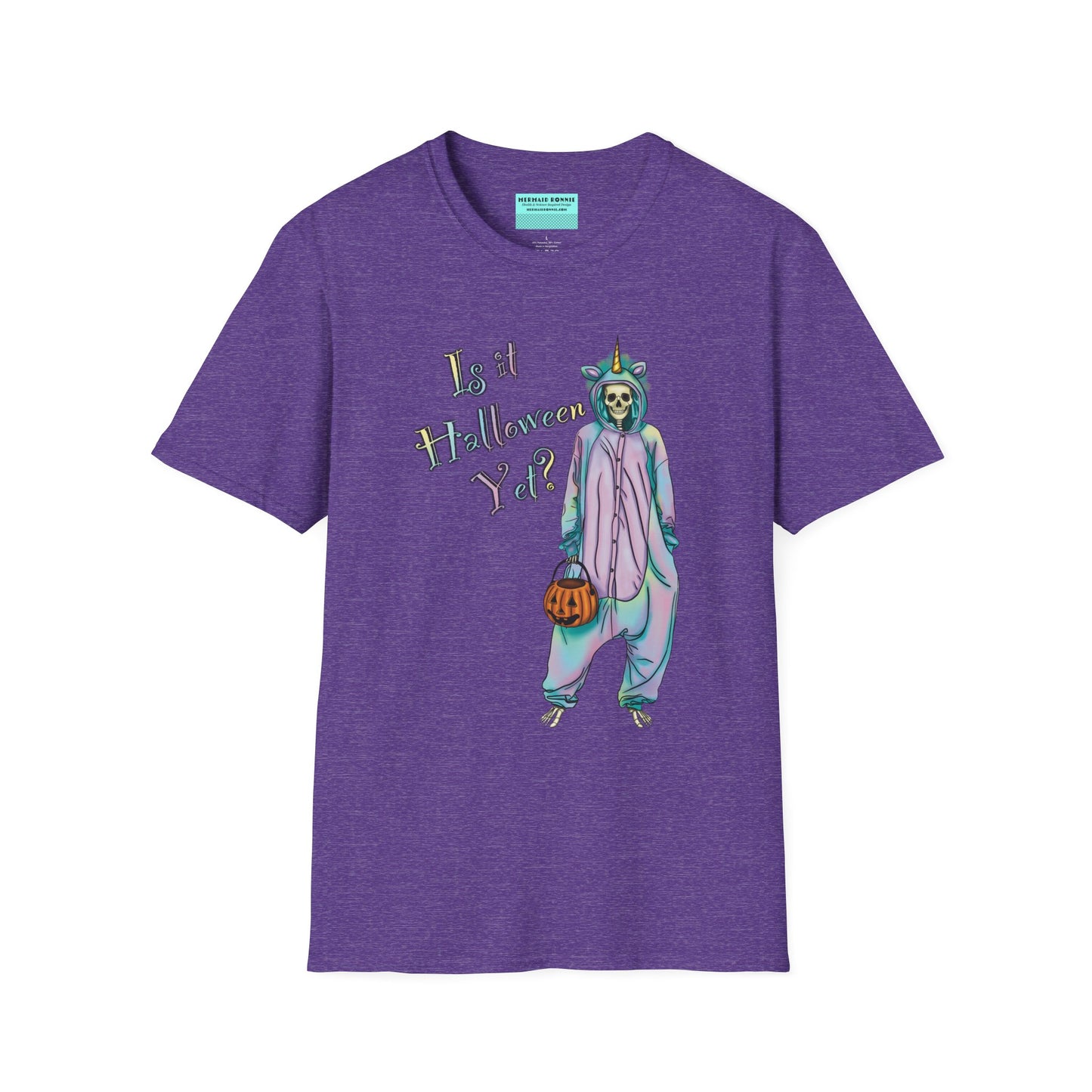 Purple t-shirt featuring a drawing of a skeleton in a unicorn costume onesie, with the phrase 'Is it Halloween yet?' printed on it.