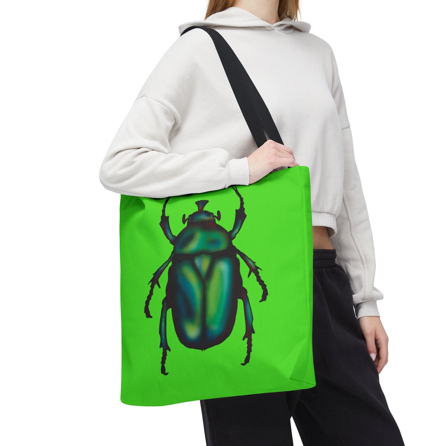 Large lime green tote bag with a black handle on a girl's shoulder featuring an illustration of a June bug (green chafer beetle).