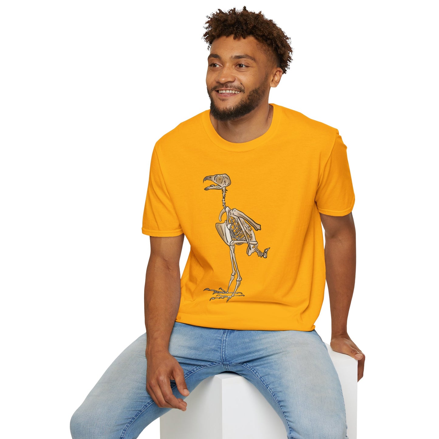Man wearing a yellow unisex short sleeve t-shirt featuring a peregrine falcon skeleton—proof that even the fastest creature on Earth looks cool in x-ray vision.