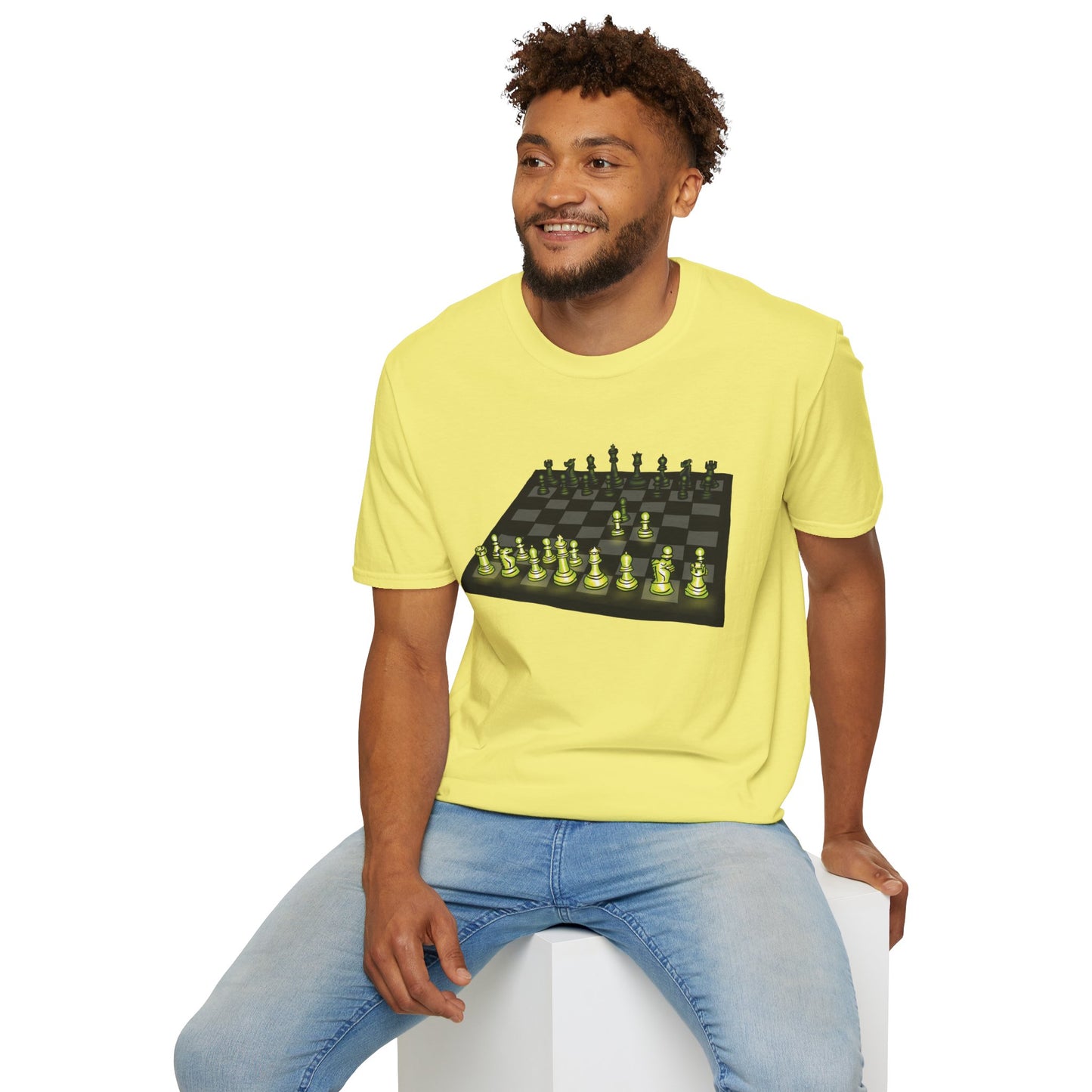 Man wearing a yellow unisex short-sleeve t-shirt featuring an electrifying chess board with glowing pieces mid–Queen’s Gambit, because nothing says “checkmate” like opening with flair and a radiant strategy.
