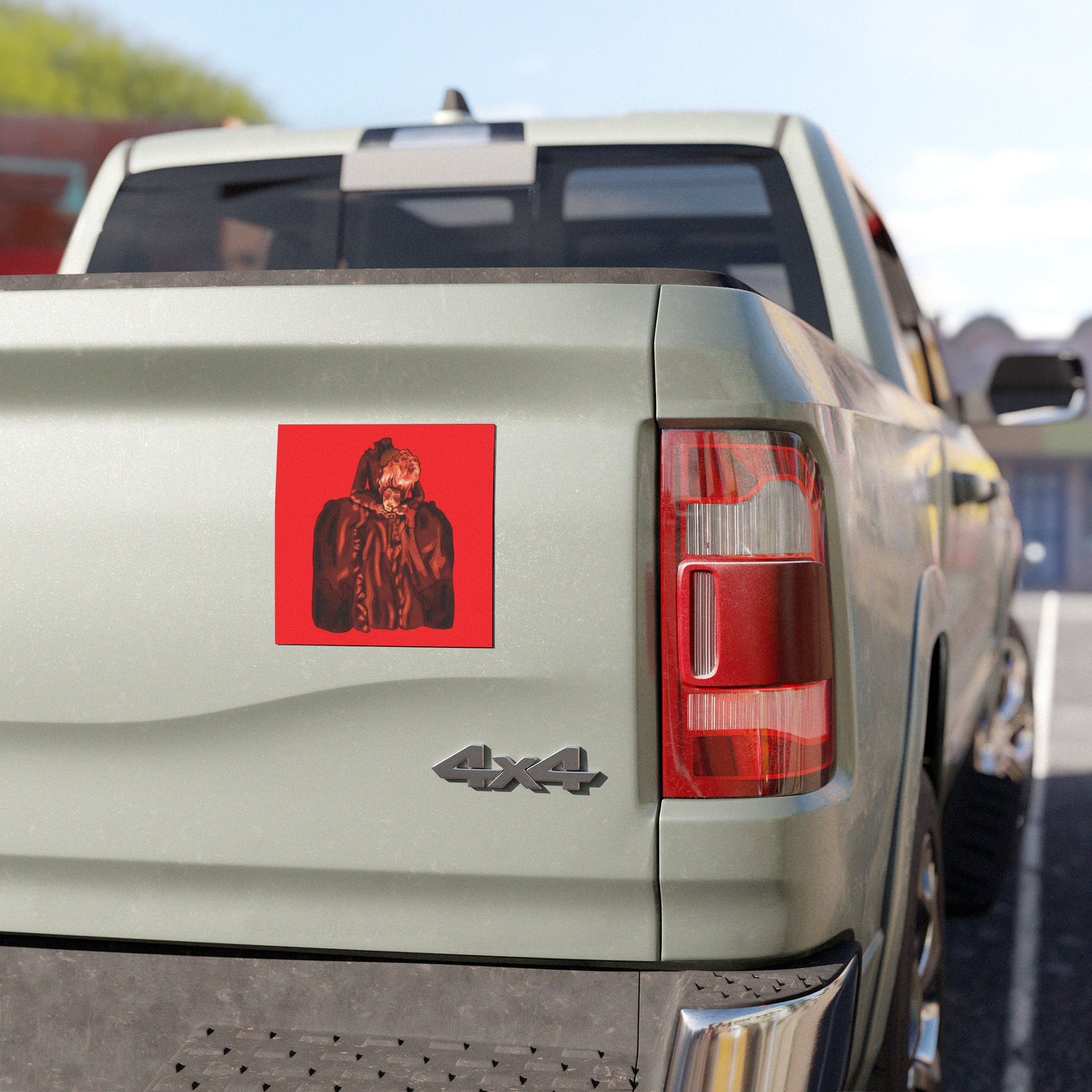 Magnet on the back of a truck with an illustration of a beheaded Marie Antoinette holding her head, set against a red background.