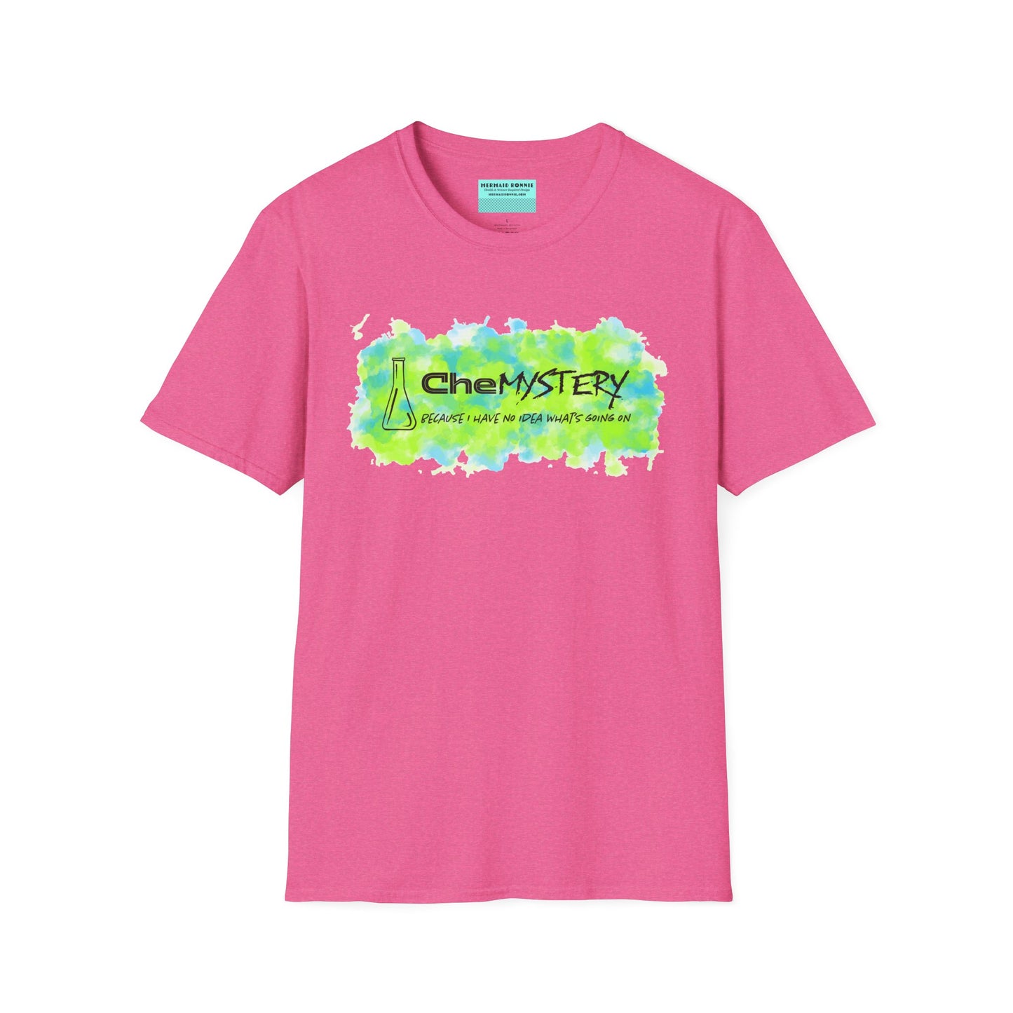 Pink short-sleeve unisex t-shirt with playful watercolor-style blue and green splotches, a simple line-drawn beaker, and the witty phrase “CheMystery: because I have no idea what’s going on”—perfect for anyone who’s ever been personally victimized by the periodic table.