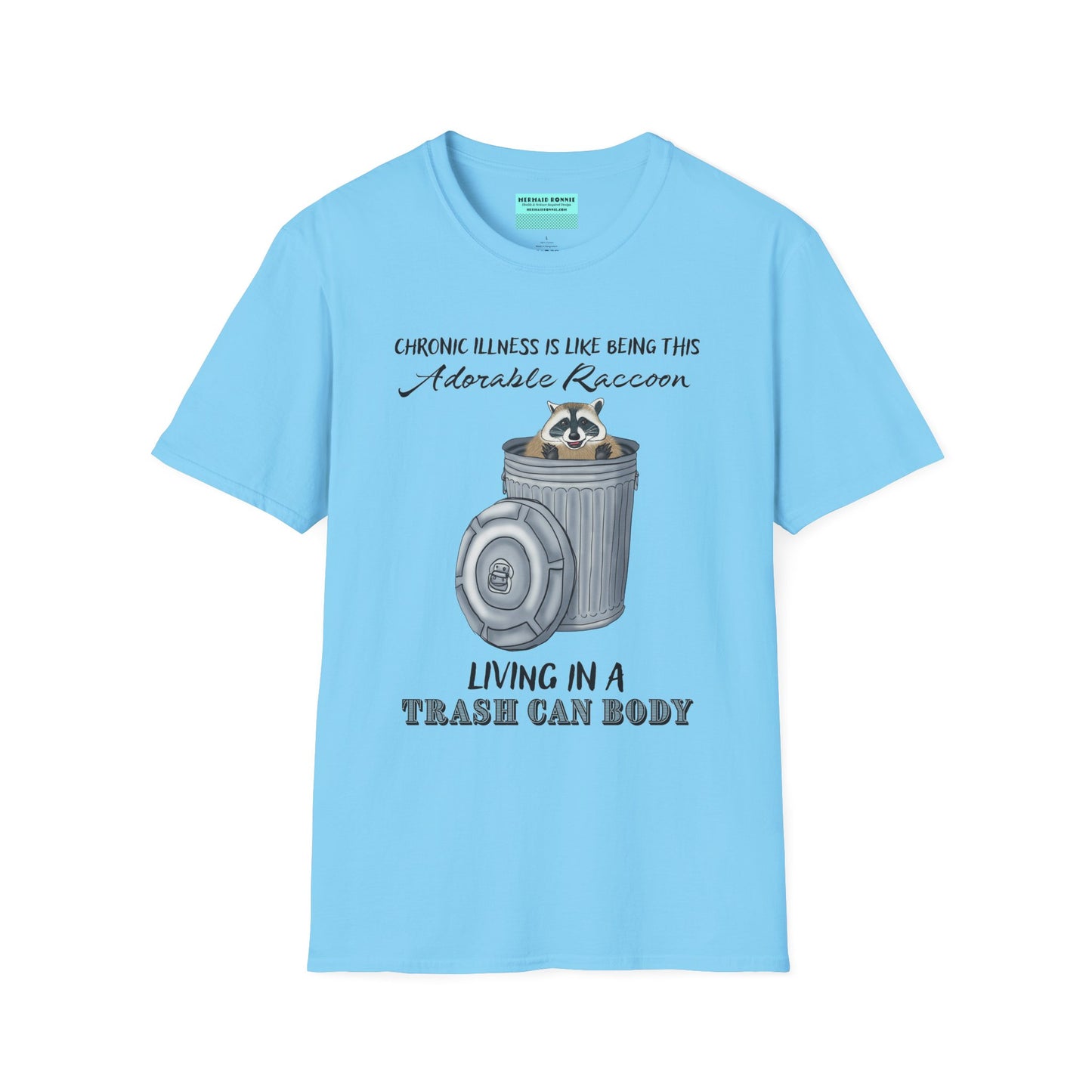 Sky blue t-shirt featuring an illustration of a raccoon in a metal trash can, with the phrase 'Chronic illness is like being this adorable raccoon living in a trash can body' printed on it.