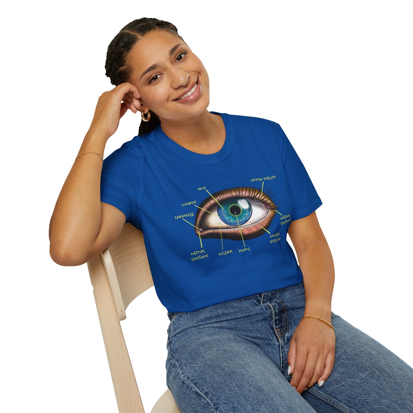Woman wearing a blue t-shirt featuring an anatomical diagram of an eye, with labeled parts of the eye displayed.