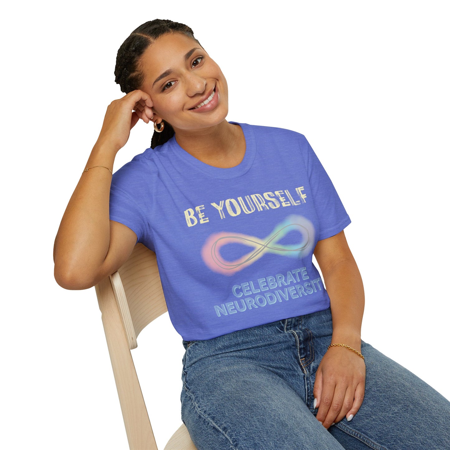 Woman wearing a blue t-shirt featuring a pastel-colored rainbow infinity symbol, with the text 'Be yourself, celebrate neurodiversity'.