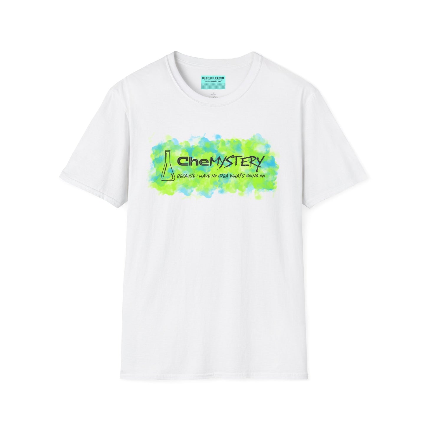 White short-sleeve unisex t-shirt with playful watercolor-style blue and green splotches, a simple line-drawn beaker, and the witty phrase “CheMystery: because I have no idea what’s going on”—perfect for anyone who’s ever been personally victimized by the periodic table.