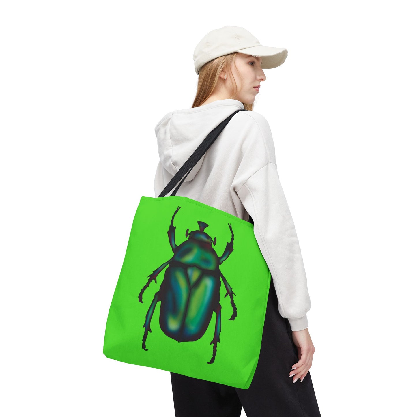 Large lime green tote bag with a black handle on a woman’s shoulder featuring an illustration of a June bug (green chafer beetle).