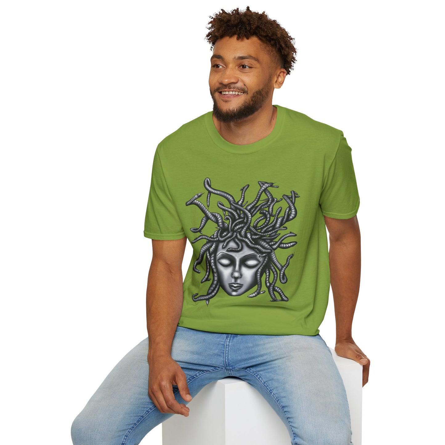 Man wearing a green t-shirt featuring a grayscale drawing of Medusa.