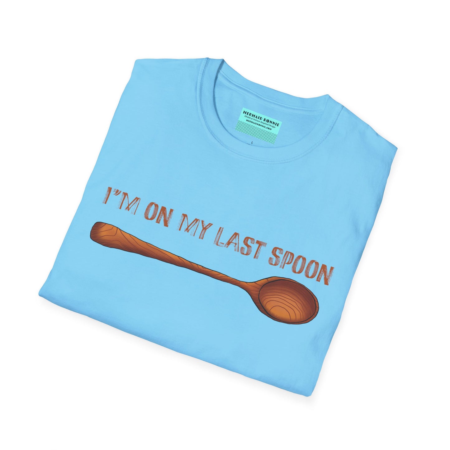 Folded blue t-shirt featuring an illustration of a single wooden spoon and the phrase 'I'm on my last spoon' printed on the front.