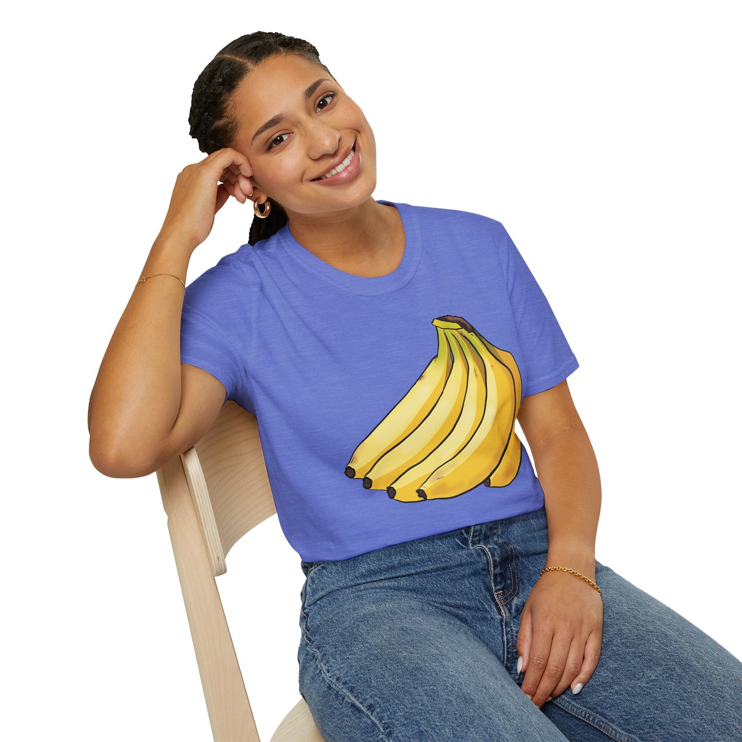 Woman wearing a cornflower blue t-shirt featuring an illustration of a bunch of bananas.