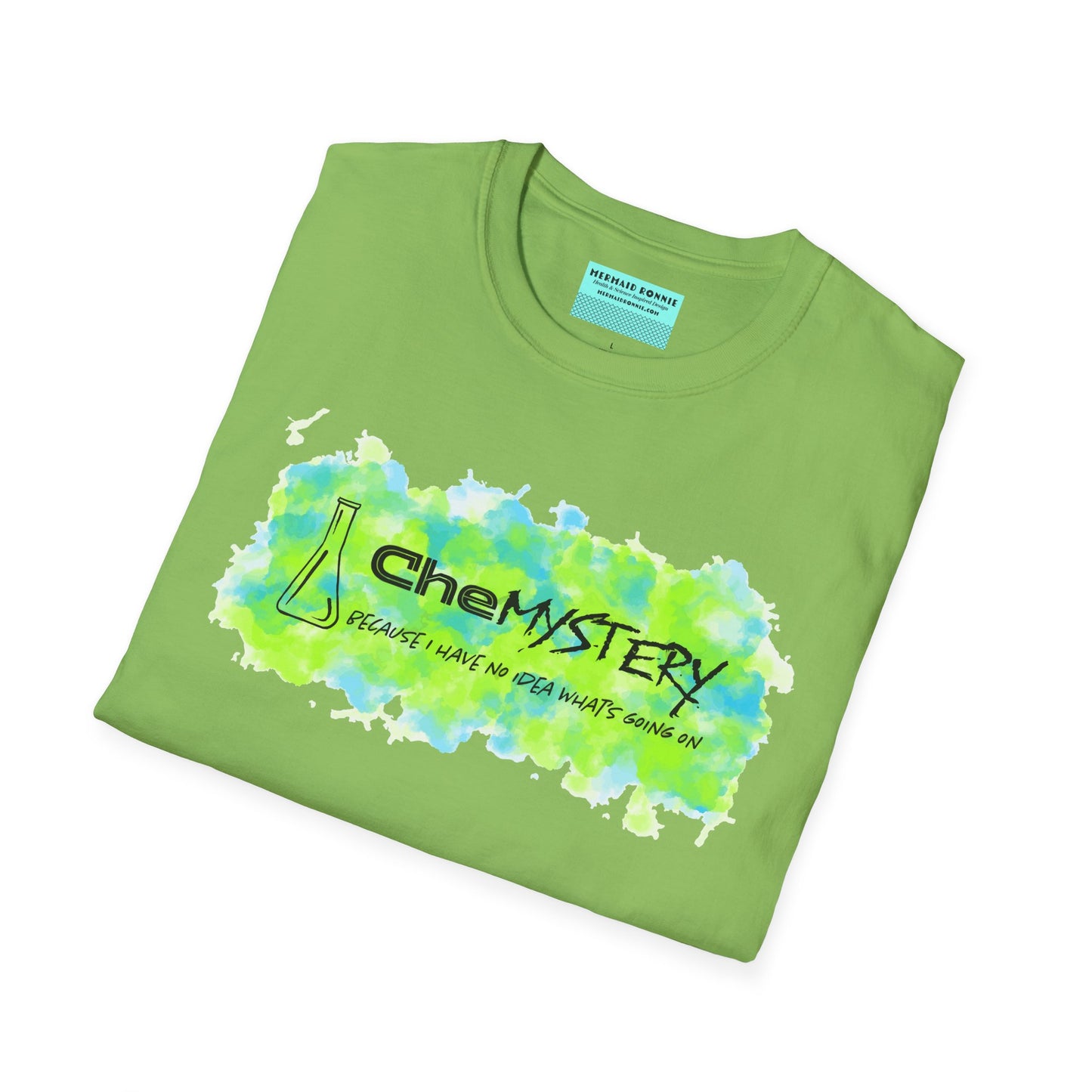 Folded green short-sleeve unisex t-shirt with playful watercolor-style blue and green splotches, a simple line-drawn beaker, and the witty phrase “CheMystery: because I have no idea what’s going on”—perfect for anyone who’s ever been personally victimized by the periodic table.