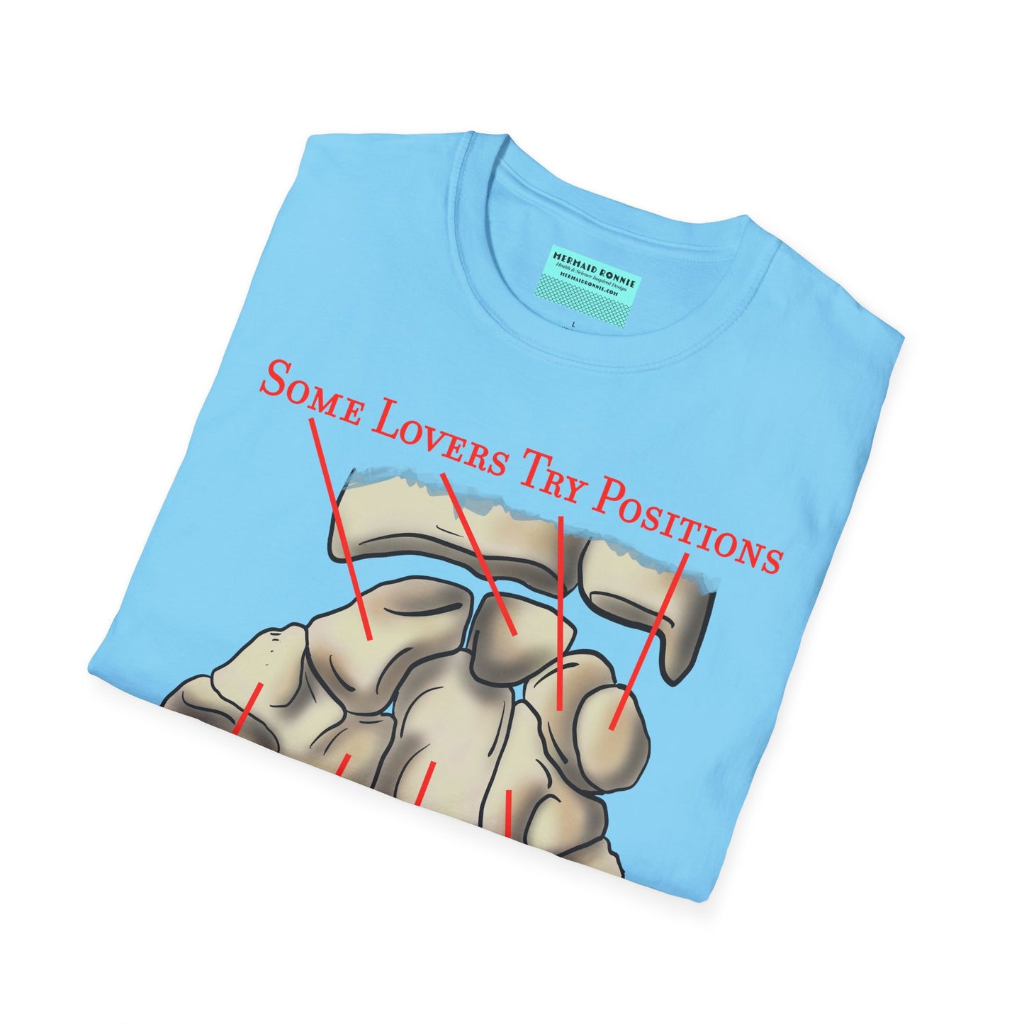Folded blue t-shirt featuring an anatomical drawing of the carpal bones, with the mnemonic 'Some lovers try positions that they can't handle' displayed.