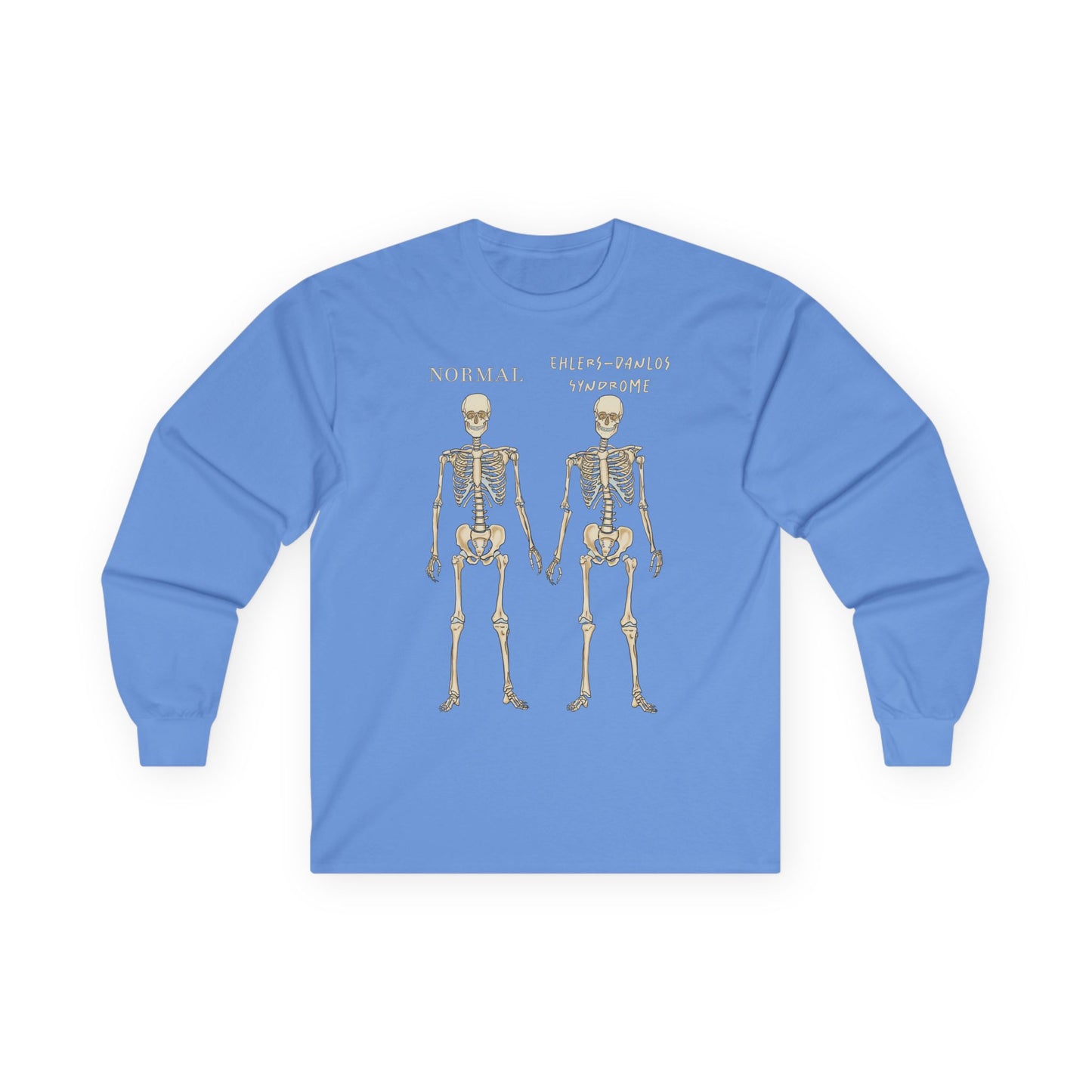 A light blue long sleeve shirt with two skeletons side by side—one labeled "normal," the other "Ehlers-Danlos Syndrome"—visually showcasing the effects of EDS with a clever, anatomy-inspired twist.