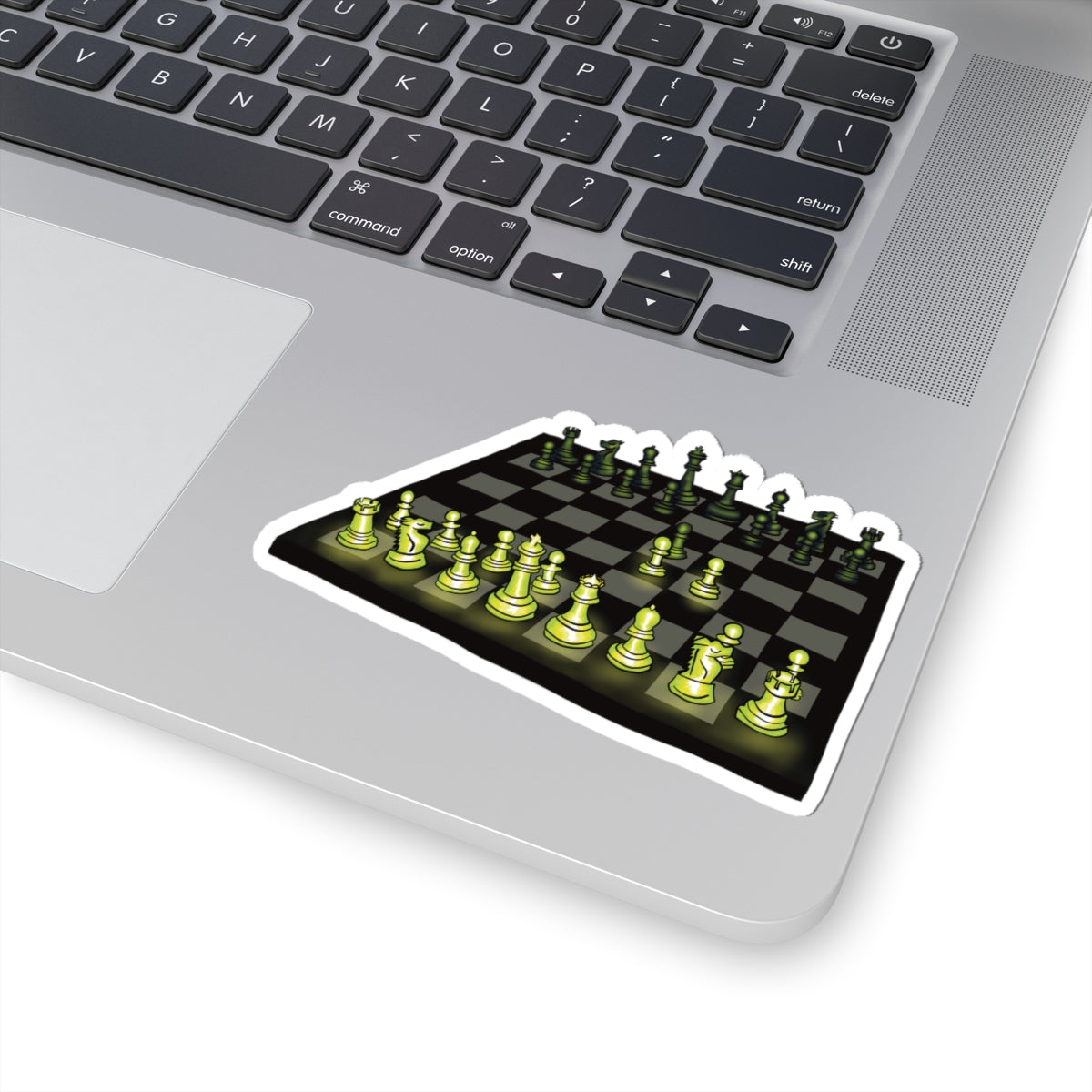 Medium sticker on a computer featuring a drawing of a chessboard with pieces illuminated by green light, showing the opening move known as the Queen’s Gambit.