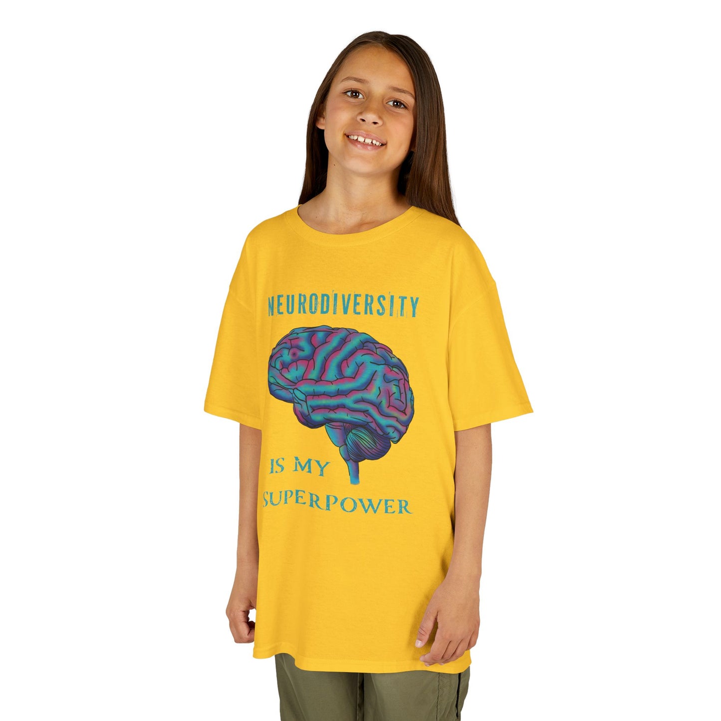 Girl is wearing a yellow unisex kids' t-shirt featuring a drawing of an anatomical brain and the text 'Neurodiversity is my superpower.'