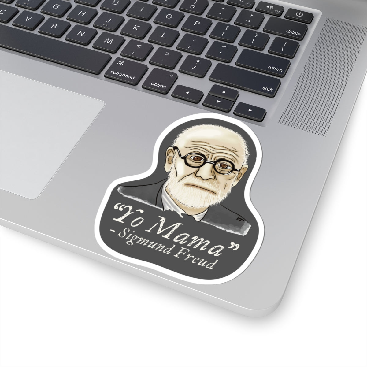 Medium sticker adhered to a computer featuring a portrait of Sigmund Freud with the humorous quote 'yo mama' written below him.