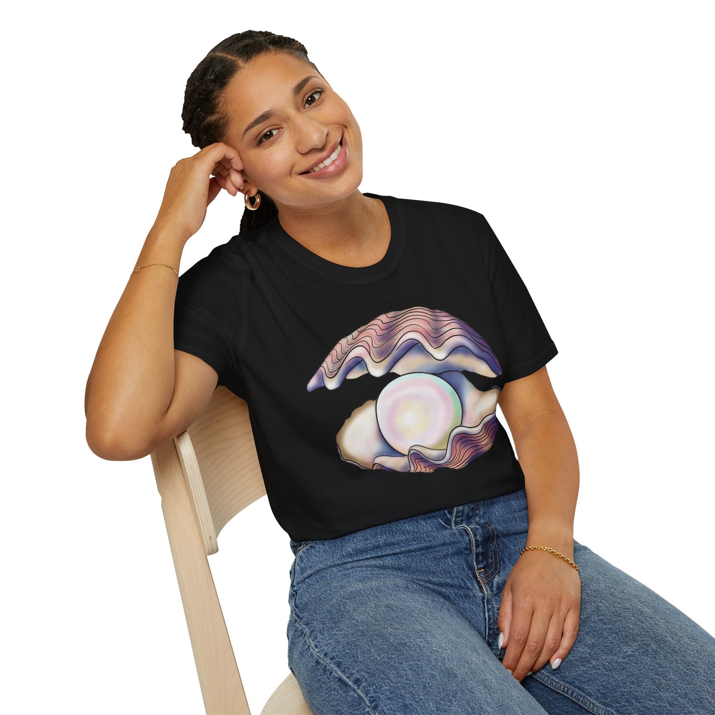 Woman wearing a black t-shirt featuring an illustration of a large oyster with a luminescent pearl inside.