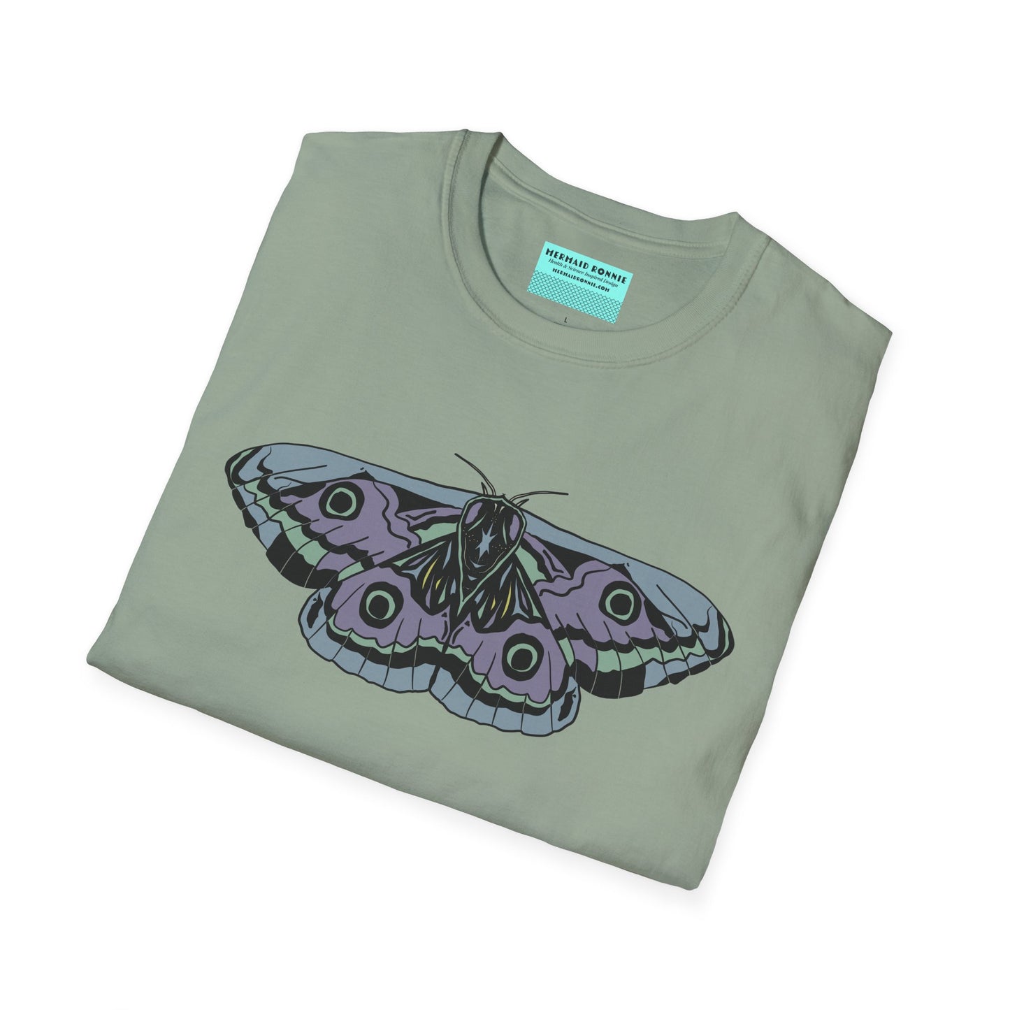 Folded sage green t-shirt featuring a drawing of a blue and purple moth.