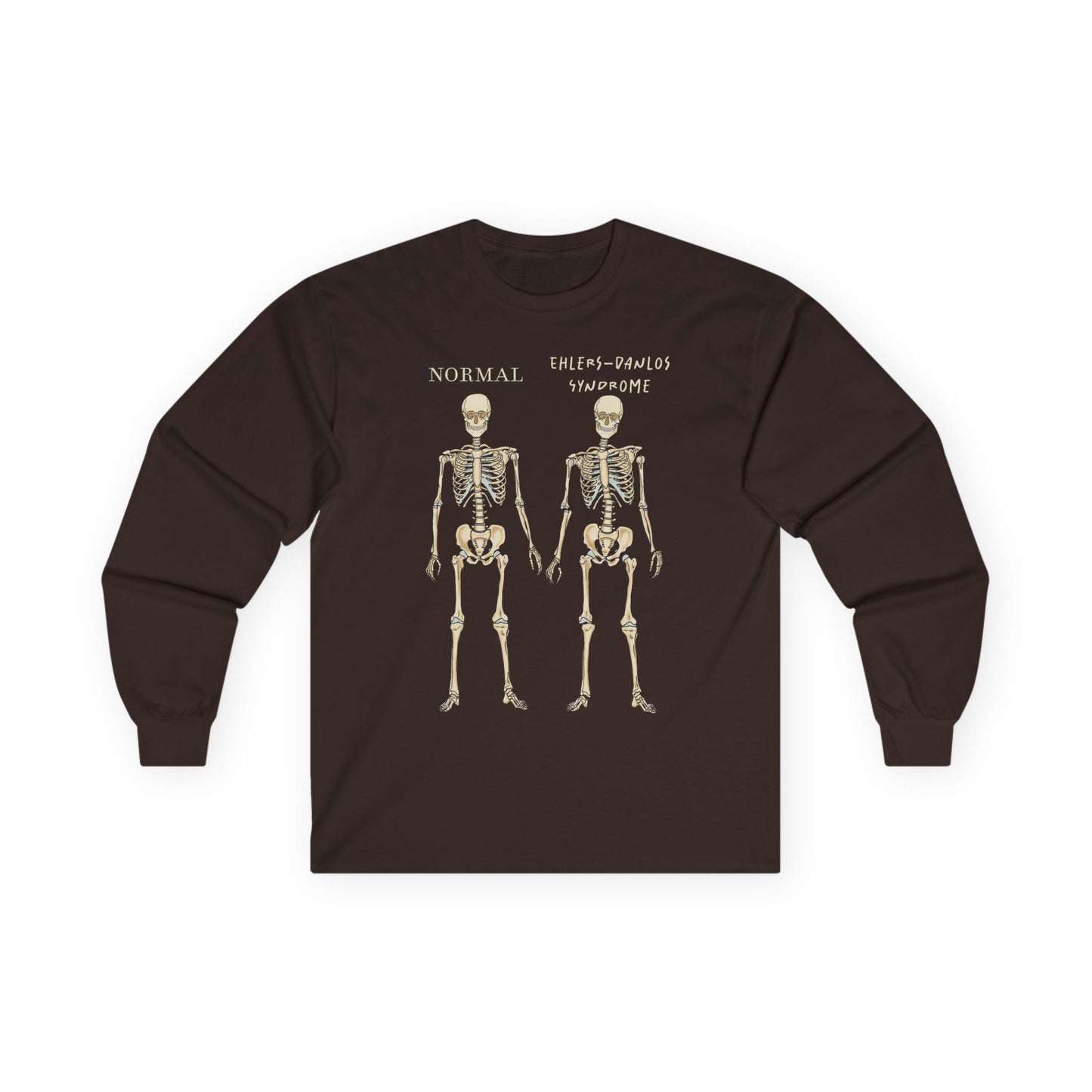 A brown long sleeve shirt with two skeletons side by side—one labeled "normal," the other "Ehlers-Danlos Syndrome"—visually showcasing the effects of EDS with a clever, anatomy-inspired twist.