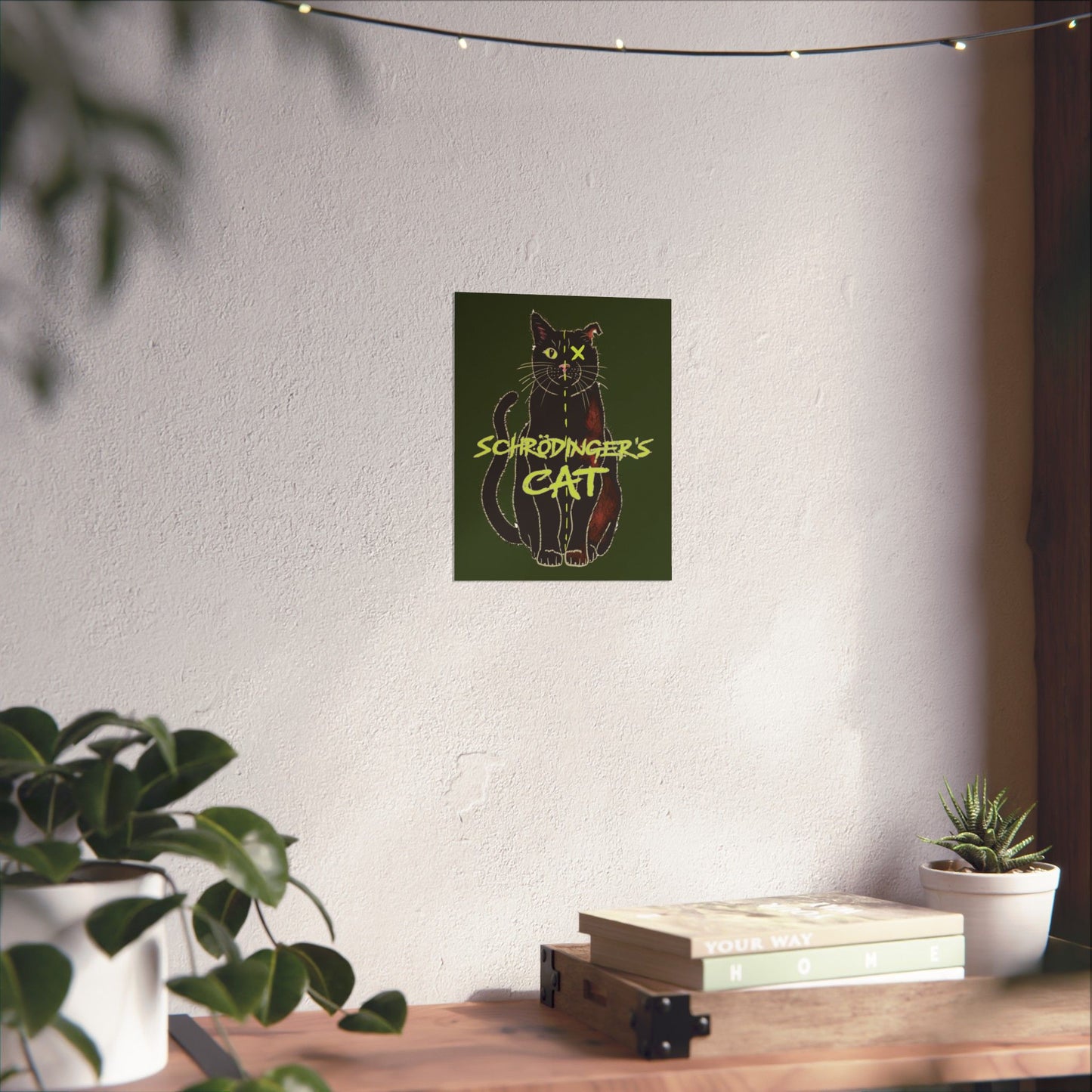 An extra-small thought-provoking Schrödinger's Cat poster set against a dark green background, featuring a black cat split down the middle—half alive, half dead. The phrase “Schrödinger's Cat” sits boldly across the image, capturing the paradox of quantum physics with a dash of feline mystery.